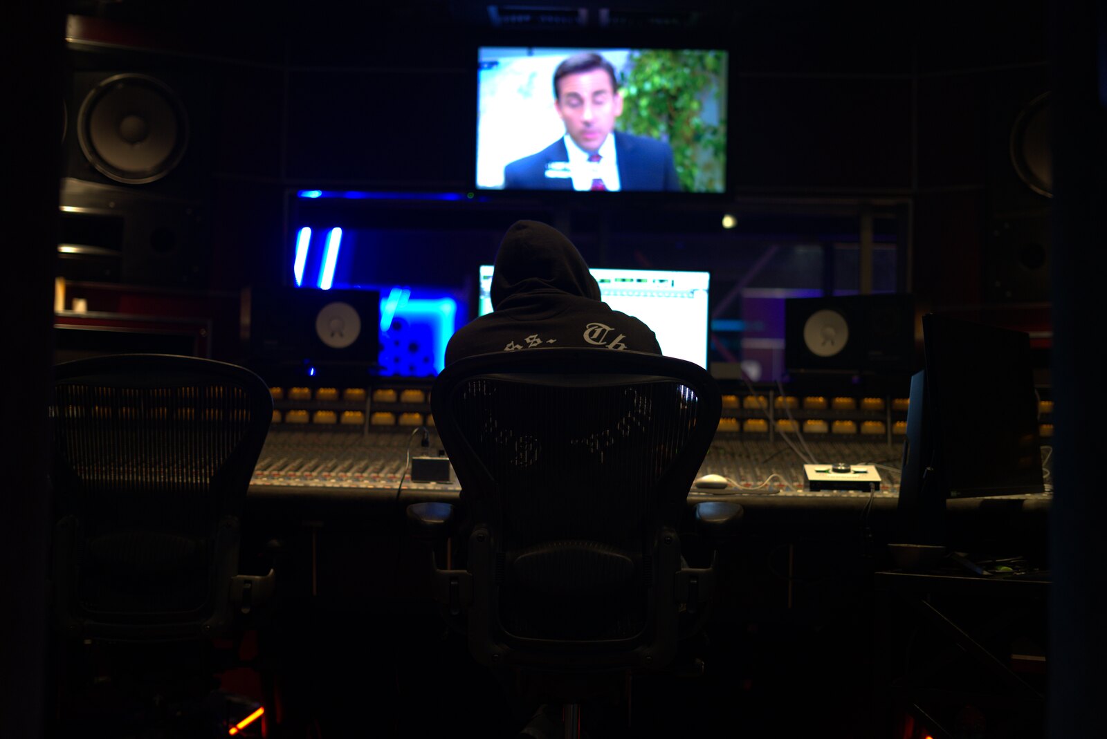 Wide control-room shot of Jonathan De La Torre working at the main console